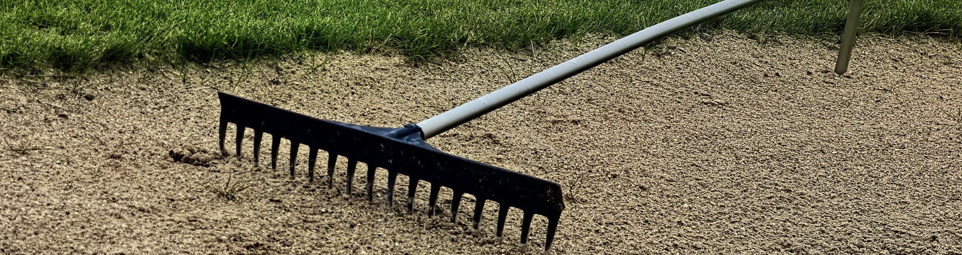 Rake in a golf course sand pit