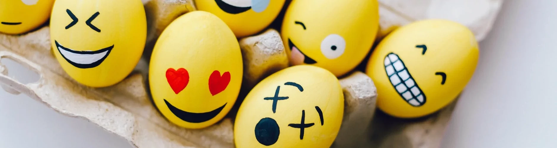 Eggs painted with emoji faces